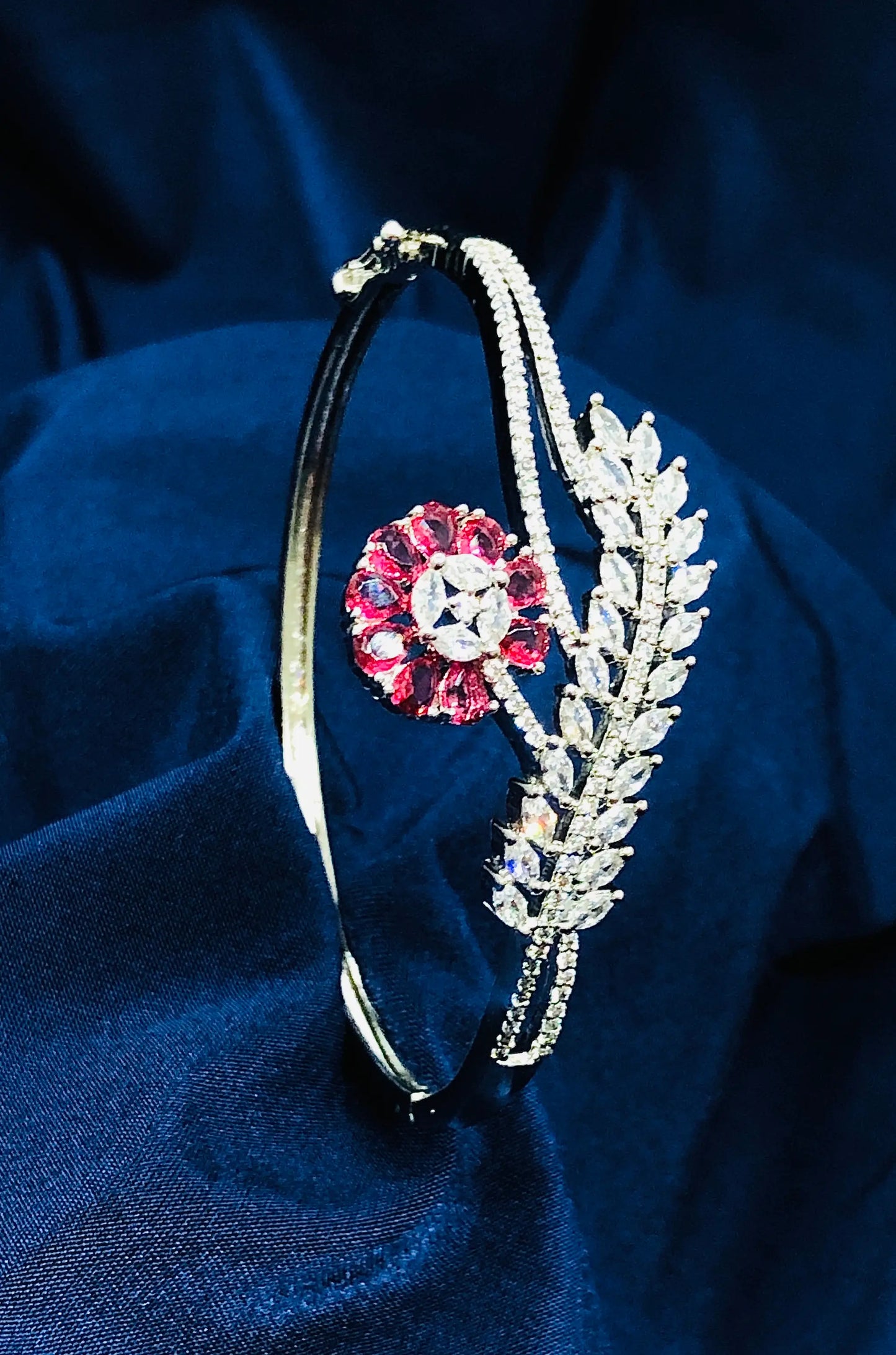 Elegant Silver Bracelet with a Striking Red Flower Detail