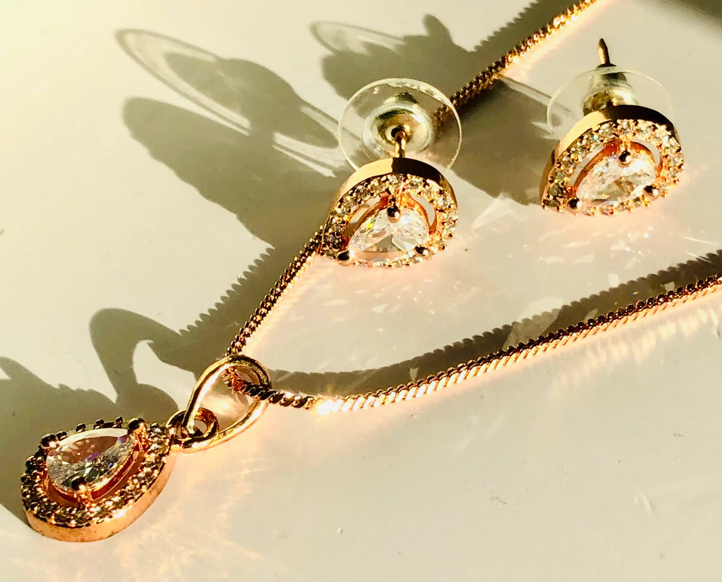 Elegant Teardrop Rose Gold Pendant Set Adorned with White Gemstones